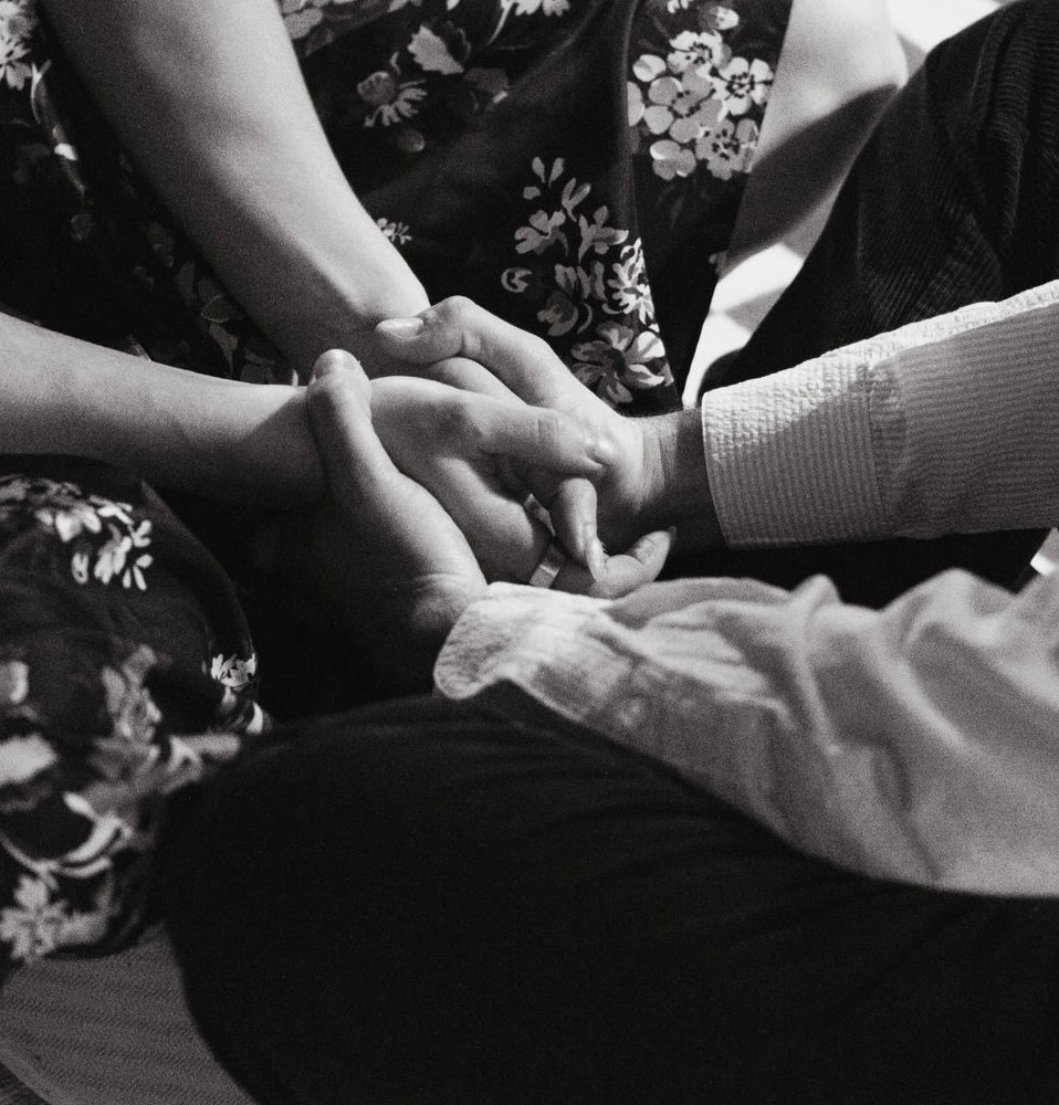 Two people holding hands